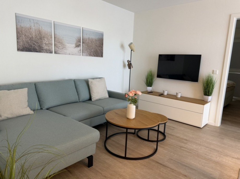 Wohnzimmer mit Schlafcouch Erdgeschosswohnung Butjadingen