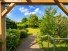 Hauptbild 'Gr�ne Oase' - Gem�tliches Einfamilienhaus mit Garage und park�hnlichem Grundst�ck in Nienhagen