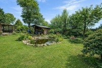 Bild (c1bd97b1e78d4aafa903b48f01fc959e): Alles auf einer Ebene! Kleiner Bungalow mit Carport in ruhiger und idyllischer Wohnlage